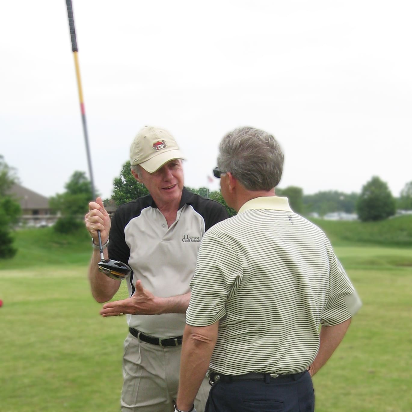 Ed LeBeau teaching a golfer at Heartland Golf Schools