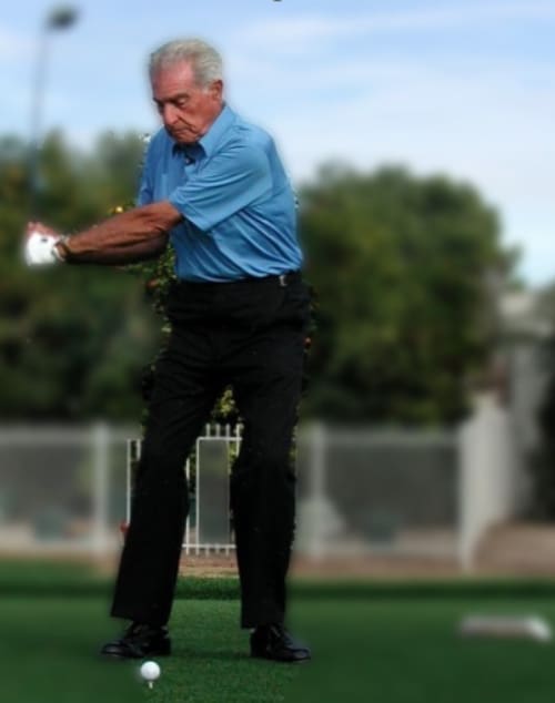 Manuel de la Torre demonstrating a golf swing position